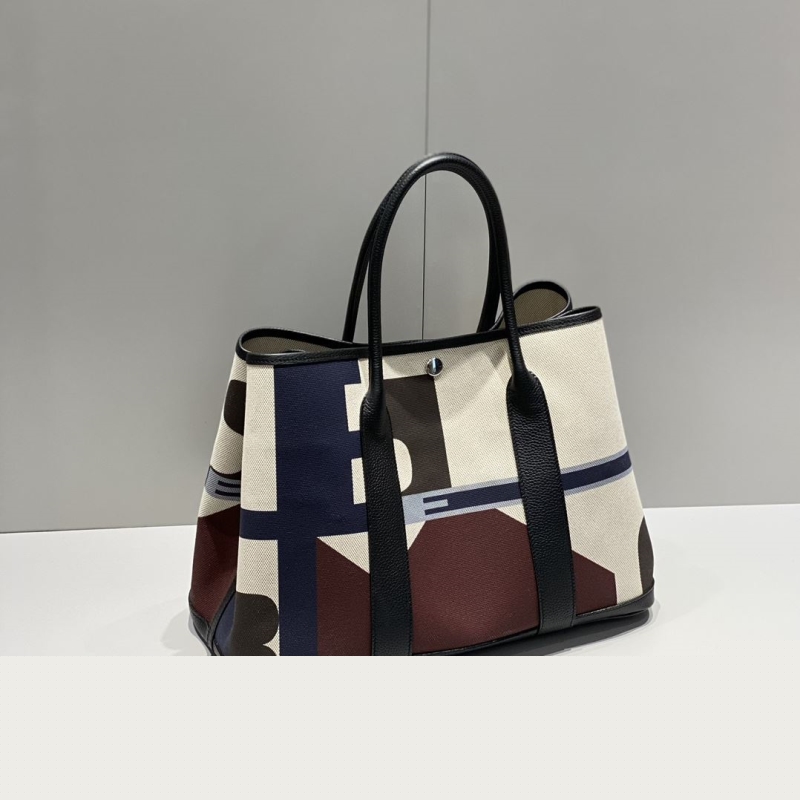 H**mes shopping bags